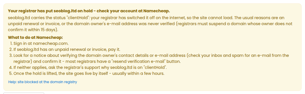 The yellow notice on a site page saying the registrar has put the domain on hold, with the steps